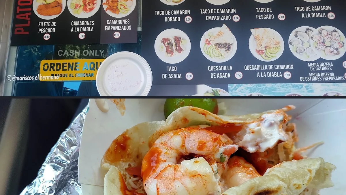 Outdoor seating at a seafood taco truck.